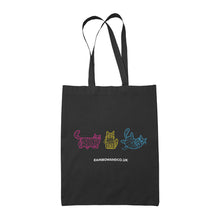 Load image into Gallery viewer, A black tote bag with three mummy cats outlined in pink, yellow, and blue, representing the pansexual pride colours. The cats are drawn in a whimsical style. The text &quot;rainbowandco.uk&quot; is displayed below the design.