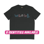 A black T-shirt featuring five mummy cat illustrations in the colours of the transgender flag. The cats are drawn in light blue, pink, and white, each wrapped in bandages and posed uniquely across the chest of the shirt. A pink text overlay at the bottom reads "8 IDENTITIES AVAILABLE," highlighting the diverse options for this design.