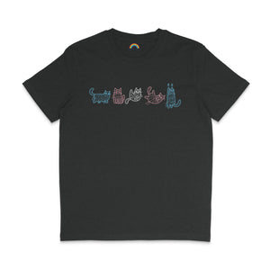 A dark heather grey T-shirt with a lineup of six cartoon mummy cats, each outlined in different pastel colours of blue, pink, and white. The cats are shown in different playful poses, perfect for celebrating both Halloween and transgender pride.