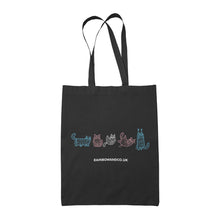 Load image into Gallery viewer, A black tote bag featuring five mummy cats in colours representing the transgender pride flag: light blue, pink, and white. Each cat is depicted in a playful manner. The text &quot;rainbowandco.uk&quot; appears beneath the design.