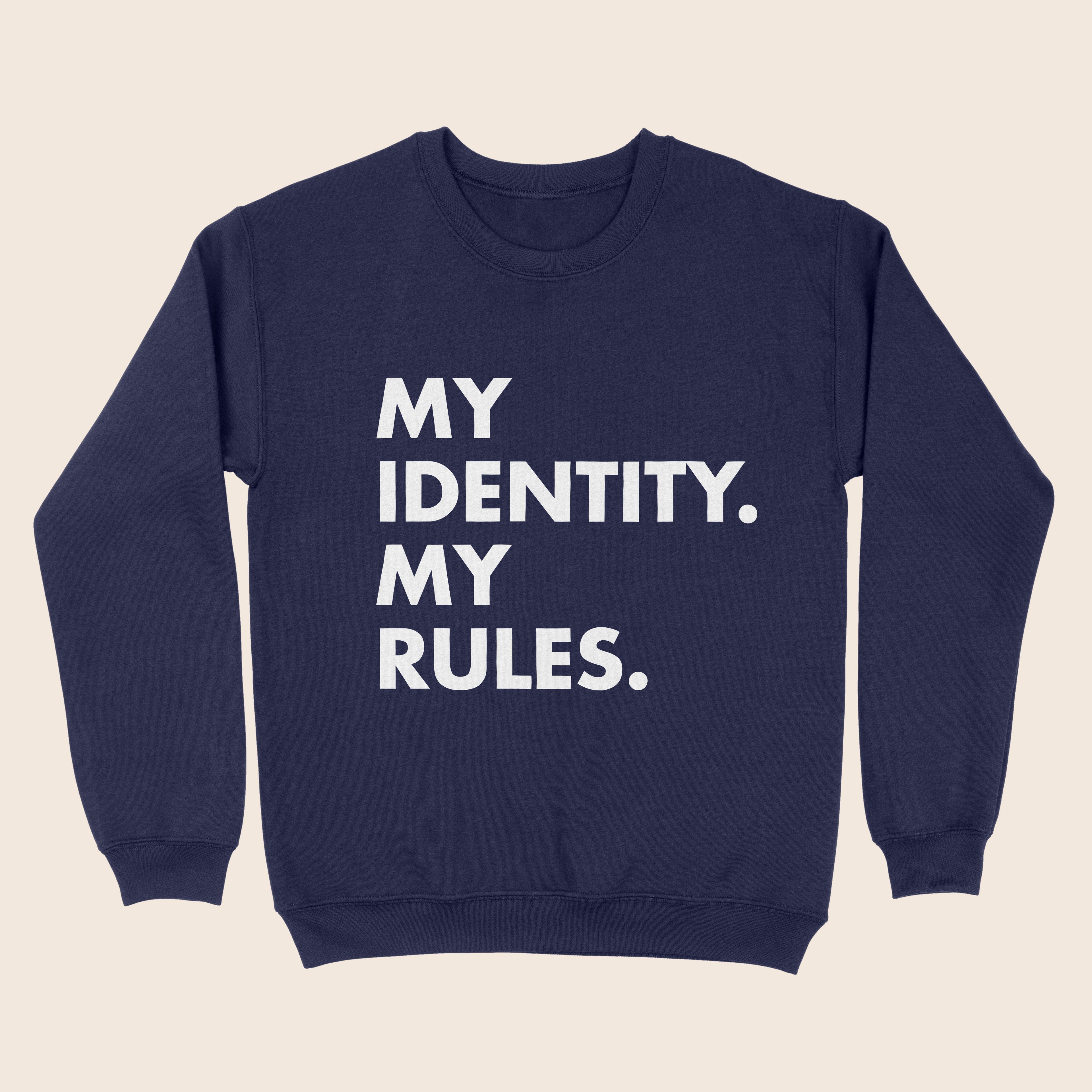 A navy blue crewneck sweatshirt featuring the bold white text “MY IDENTITY. MY RULES.” in all caps, shown on a plain beige background.