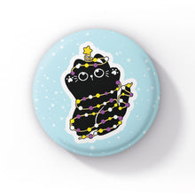 Load image into Gallery viewer, A black cat tangled in string lights in the colours of the non-binary flag (yellow, white, purple, and black), lying on its back against a light blue background with snowflakes.