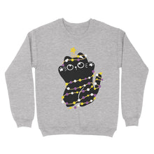 Load image into Gallery viewer, A heather grey sweatshirt featuring a black cat wrapped in string lights in the non-binary flag colours—yellow, white, purple, and black. The cat wears a star on its tail, giving a festive look.