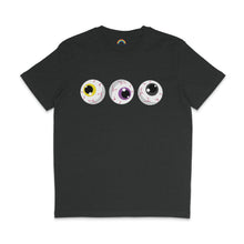 Load image into Gallery viewer, A dark heather grey t-shirt with three eyeballs, each with yellow, purple, and black irises, reflecting the colours of the Non-Binary pride flag. The design is cartoonish with red veins, aligned horizontally across the chest.