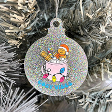 Load image into Gallery viewer, Close up of a white Christmas tree displaying a silver glitter bauble featuring retro text reading &#39;cosy vibes&#39;. The image shows a mug of hot chocolate with marshmallows and a gingerbread man wearing a Santa hat. A candy cane in the mug and lights around the mug are the colours of the pansexual pride flag.