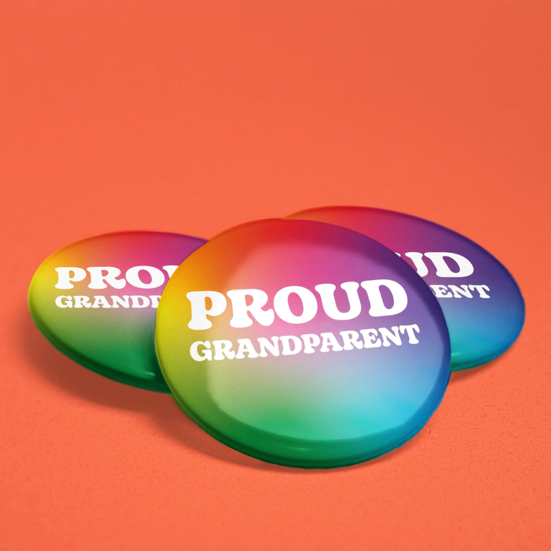 Three Proud Grandparent rainbow pride badges displayed on an orange background.
