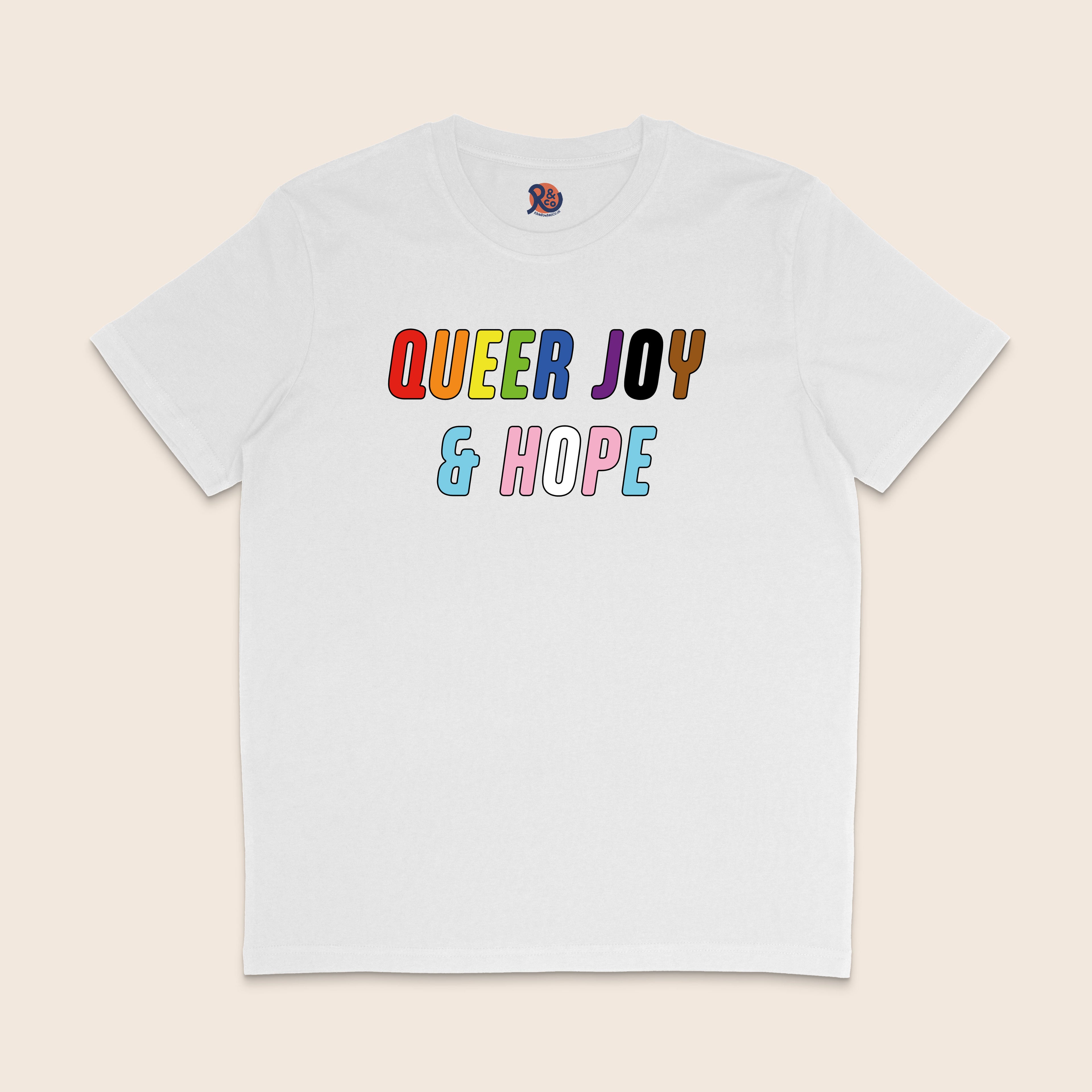 White T-shirt with colourful text reading “Queer Joy & Hope” across the chest in rainbow and trans Pride-inspired colours.