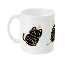 Load image into Gallery viewer, Left view of a white ceramic mug showing a black cat wrapped in rainbow-coloured Christmas lights, with the cat&#39;s face and star visible.