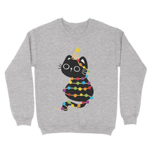 Load image into Gallery viewer, Heather grey sweatshirt showcasing a cute black cat tangled in rainbow festive lights, topped with a star decoration on its tail.