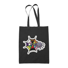 Load image into Gallery viewer, A black tote bag featuring a cute cartoon spider in front of a spider web coloured in the rainbow pride flag colours: red, orange, yellow, green, blue, purple, black, and brown.