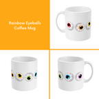 A composite image of a white coffee mug with a cartoon eyeball design in rainbow pride flag colours.