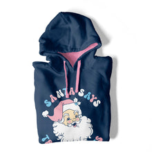 Load image into Gallery viewer, A folded Oxford Blue hooded sweatshirt with contrasting pink inner hood and drawcords on a white background. The hoodie features the design Santa Says Trans Rights and an image of Santa Claus in the colours of the transgender flag.