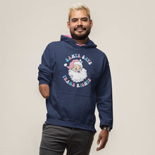 Load image into Gallery viewer, A bearded man wearing an Oxford Blue hooded sweatshirt with contrasting pink inner hood and drawcords on a white background. The hoodie features the design Santa Says Trans Rights and an image of Santa Claus in the colours of the transgender flag.
