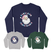 Load image into Gallery viewer, Three sweatshirts with a Santa Says Trans Rights motif in the colours of the Transgender flag. One is Oxford Navy, one Bottle Green, and one Heather Grey.