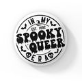 A round badge with a white background featuring the text "In My Spooky Queer Era" in black, with a Halloween-themed design. The words "Spooky Queer" are styled with dripping, spooky letters, surrounded by small illustrations of bats and skulls. The text "EST. 1692" is included, referencing the year of the Salem witch trials.