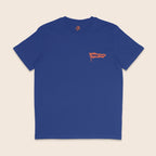 Front of a royal blue organic cotton t-shirt featuring a small orange Rainbow & Co flag logo printed on the left chest.