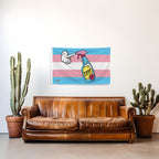 Brown leather sofa in a room with a Trans Pride flag featuring a spray bottle of TERF Repellent on the wall, potted cacti on either side.