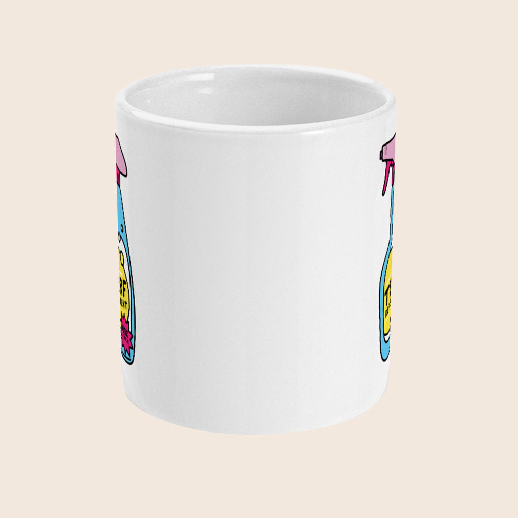 A white ceramic mug is shown at a slight angle with two TERF Repellent spray bottle illustrations printed on either side of the visible face. The bottles are brightly coloured with pink nozzles, blue bodies, and yellow labels that say “TERF REPELLENT” in bold black text. A pink starburst near the bottom reads “100% EFFECTIVE.”