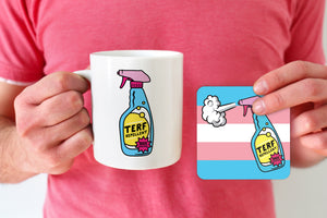 A white ceramic mug featuring a colourful "TERF Repellent" design with a spray bottle, alongside a matching square coaster with the same design over a transgender pride flag background. The mug is held by a person wearing a pink shirt.