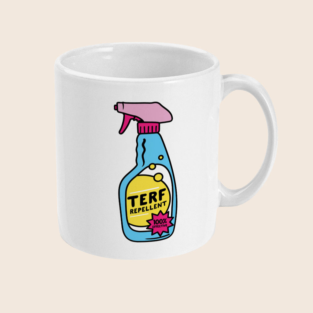 A white ceramic mug is shown side-on with a single illustration of the TERF Repellent spray bottle in the centre. The bottle has a pink nozzle, blue body, and yellow label with the words “TERF REPELLENT” and a pink burst that reads “100% EFFECTIVE.” The image is clean and well-lit with a neutral background.