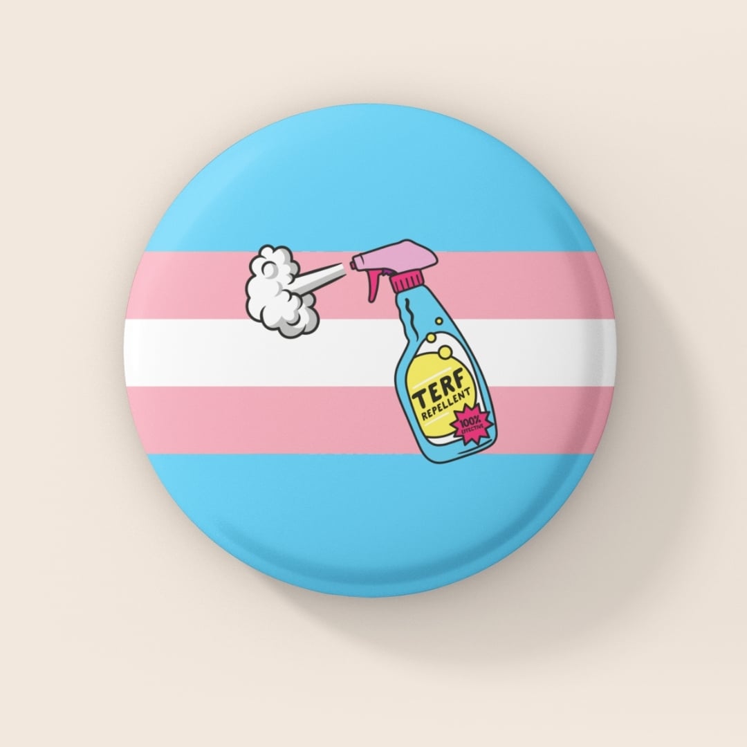 38mm round badge featuring the trans pride flag colours with an illustrated spray bottle labelled “TERF Repellent – 100% Effective” on a blue and pink striped background.