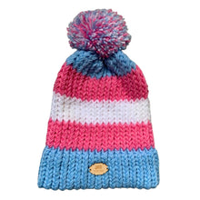 Load image into Gallery viewer, Striped knitted bobble hat in the colours of the Transgender pride flag laying flat.