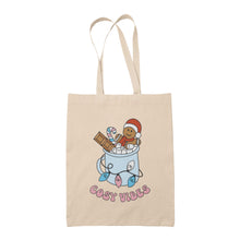 Load image into Gallery viewer, Natural tote bag featuring retro text reading &#39;cosy vibes&#39;. The image shows a mug of hot chocolate with marshmallows and a gingerbread man wearing a Santa hat. A candy cane in the mug and lights around the mug are the colours of the transgender pride flag.