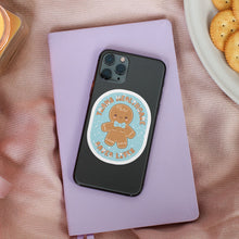 Load image into Gallery viewer, A gingerbread figure with a top surgery scar, a bow tie, and the text &quot;Trans Healthcare Saves Lives&quot; displayed on a mobile phone case, showing a subtle yet powerful statement.