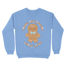 Load image into Gallery viewer, Cornflower blue sweatshirt with a gingerbread person design and the text &#39;Trans Healthcare Saves Lives&#39; in holiday-themed typography.