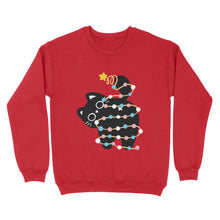 Load image into Gallery viewer, Red sweatshirt featuring a black cat wrapped in festive lights in the colours of the transgender pride flag, playfully lifting its tail with a star on top.