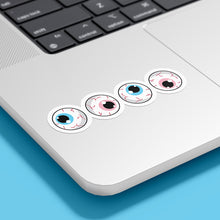 Load image into Gallery viewer, Four circular stickers with eyeball designs are placed on the bottom corner of a silver laptop. The irises are blue, pink, white, and pink, representing the transgender pride flag.