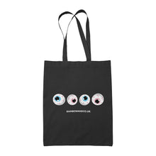 Load image into Gallery viewer, A black tote bag featuring four cartoonish eyeballs arranged in a row. Each eyeball has a different coloured iris, representing the transgender flag: one with a light blue iris, one with a pink iris, one with another light blue iris, and one with another light pink iris. Below the eyeballs, the text reads &quot;RAINBOWANDCO.UK&quot;.