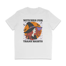Load image into Gallery viewer, White crew neck shirt featuring the slogan Witches for Trans Rights with an illustrated graphic of a witch with bats flying around her hat