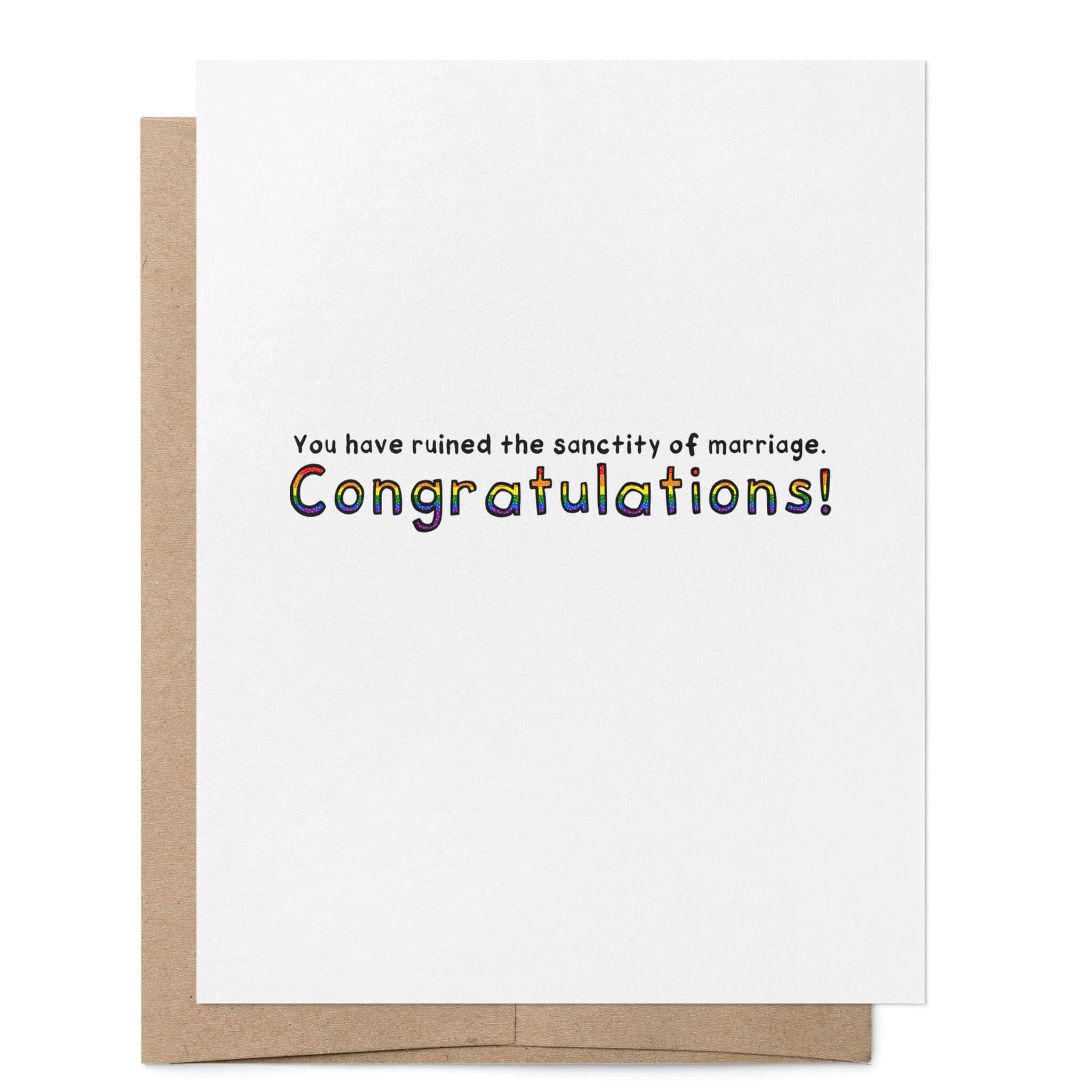 White greeting card featuring the words "You have ruined the sanctity of marriage. Congratulations!" with "Congratulations!" written in rainbow lettering, with a brown kraft envelope behind.