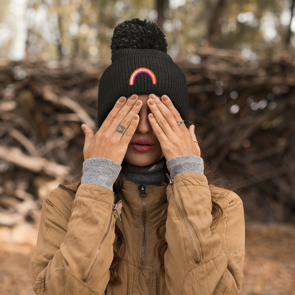 Woman Wearing Lesbian Pom Pom Beanie Hat