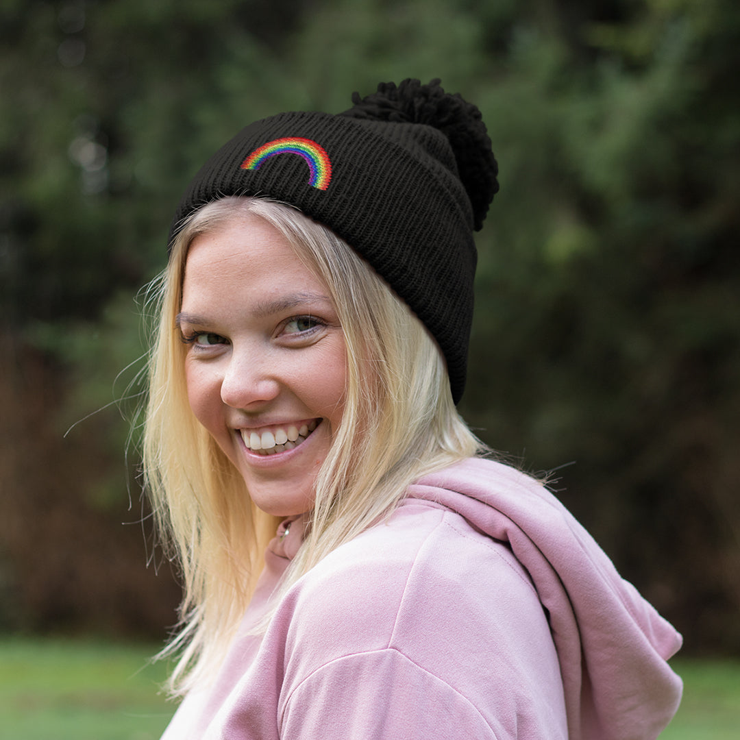 Woman Wearing Rainbow Pride Beanie | Rainbow & Co